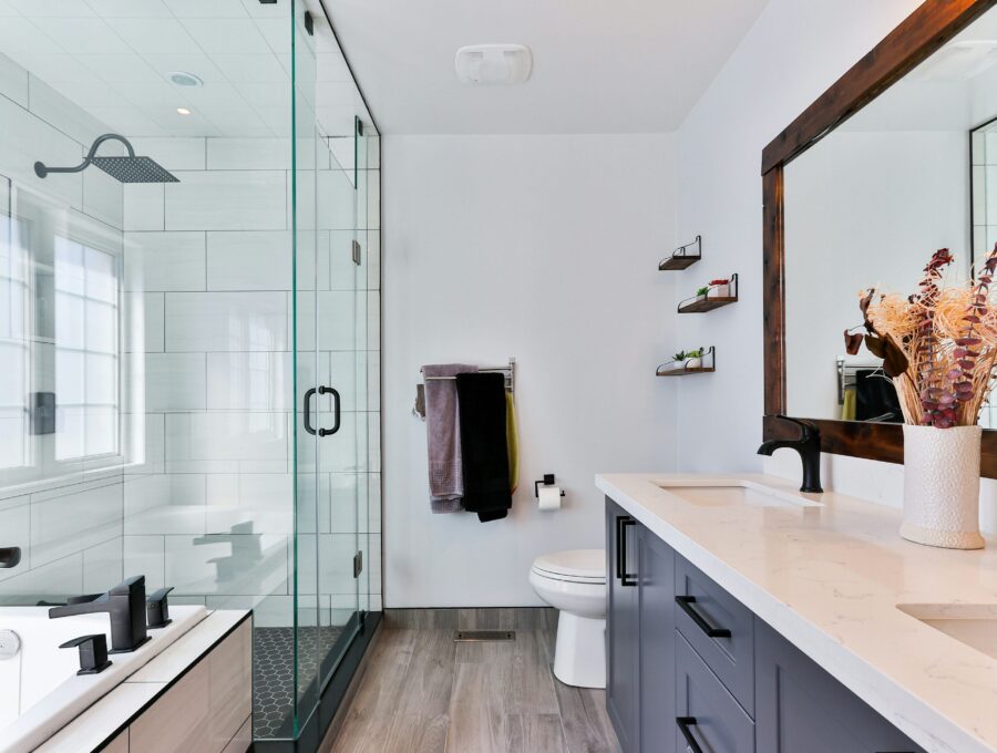Contemporary bathroom with glass shower, dark vanity and black fixtures