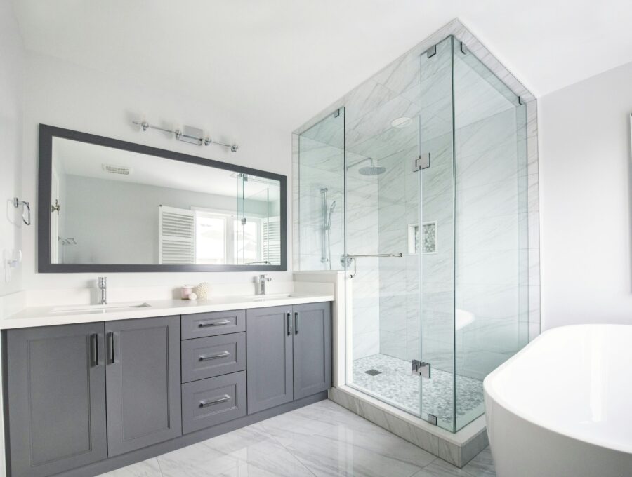 Bright ensuite with double vanity, glass shower and freestanding bathtub